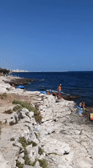 Summer morning on the rocks in Molfetta, Adriatic coast.