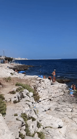 Summer morning on the rocks in Molfetta, Adriatic coast.