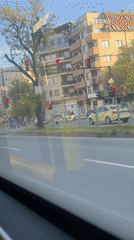 Early morning street scene recorded from moving vehicle in Varna