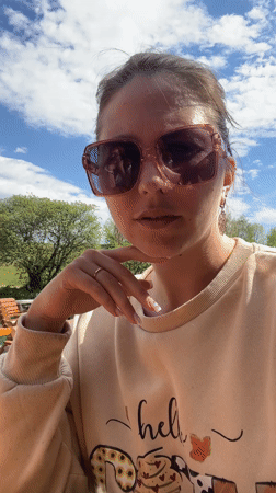 White goose spotted on rock by water in Podgorica