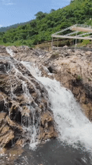 Suoi Ba Waterfall, Khanh Vinh — rocks, rapids, jungle backdrop