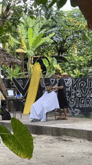 Outdoor barber service documented in General Luna, Philippines