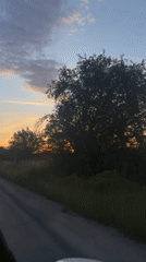 Sunset captured from moving vehicle on Bulgarian rural road