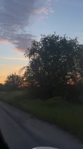 Sunset captured from moving vehicle on Bulgarian rural road