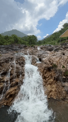 Tourists visit waterfall swimming spot in Khanh Vinh Vietnam
