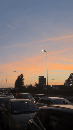Milan sunset captured across streets and Navigli canals