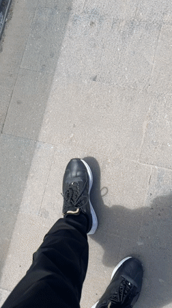 Tourists gather at Spanish coastal viewpoint overlooking ocean