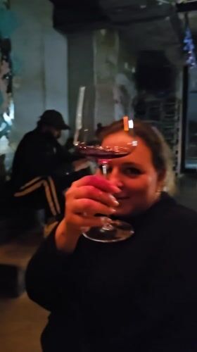 Couple spotted at Moscow bar with Russian wine signage