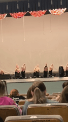 Kids' dance recital on a decorated indoor stage