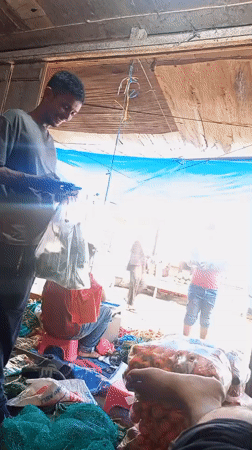 Late-night market cooking and vendor prep in Lhokseumawe