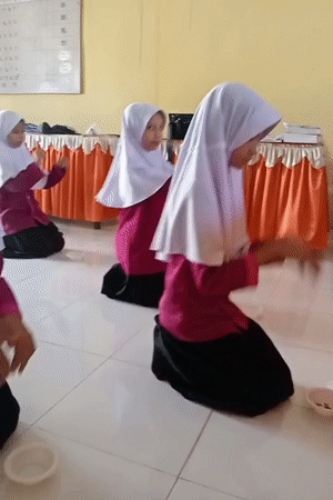Young girls perform traditional dance in Keudekrueng, Indonesia