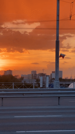 Fiery sunset documented across Novosibirsk bridges and highways