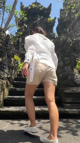 Tourist documents Balinese architecture at Kedewatan hotel