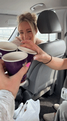 Impromptu paper cup toast inside a Moscow van