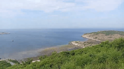 Elevated coastal lookout with island views and calm seas