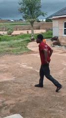 Young people play sports in Bukuru neighborhood yard