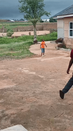 Young people play sports in Bukuru neighborhood yard