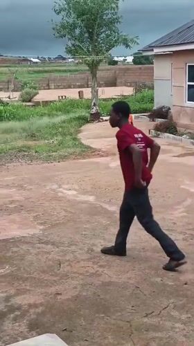 Young people play sports in Bukuru neighborhood yard