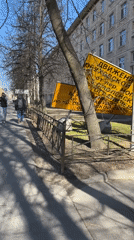 Fallen traffic signs observed near billboard in Saint Petersburg