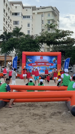 Beach team-building event on Nha Trang's rocky coastline