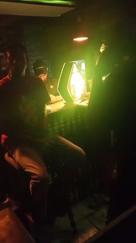 Night out at Lokoja club with colored lights and socializing