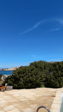 Sunny patio scene captured at Cala Francese, Italy