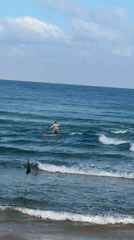 Surfers out on a quiet morning at Tel Aviv beach
