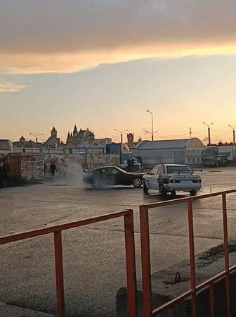 Car stunts and drifting in a wet Yoshkar-Ola lot