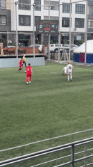 Soccer match played between red and white teams in Astana