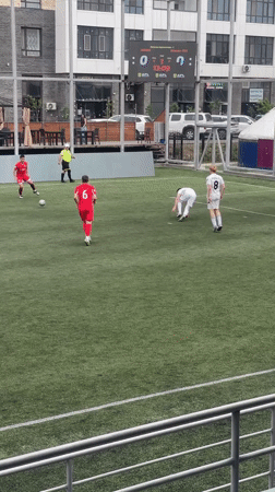 Soccer match played between red and white teams in Astana