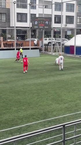 Soccer match played between red and white teams in Astana