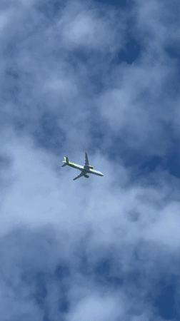 Morning sky watching captures airplane, clouds in Dreiliņi, Latvia