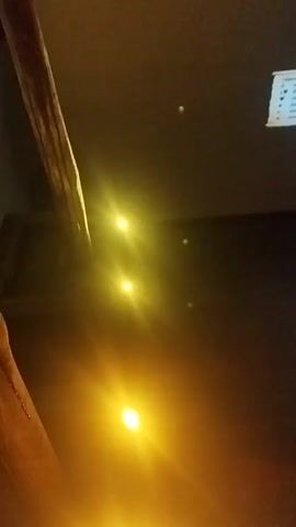 The video shows a dimly lit room with a large screen displaying a family tree. The family tree is intricate and detailed, with many branches and names. The screen is illuminated by bright lights, which cast a warm glow on the surroundings. The video appears to be a close-up shot of the screen, as the details of the family tree are the main focus. The camera moves slightly, giving a sense of movement and depth to the image. The overall impression is one of a historical or genealogical display, possibly in a museum or a research facility.