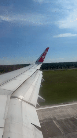 Air Asia plane observed taxiing at Malaysian airport