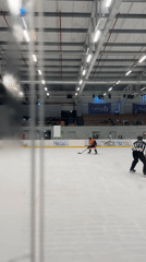 Ice hockey game in progress at indoor rink in Israel