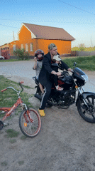 Family activities captured in rural Russian village afternoon