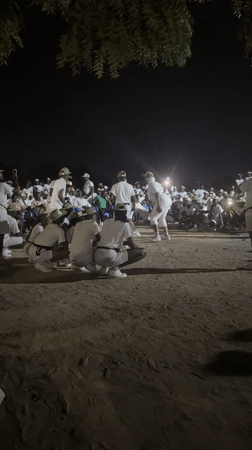 Uniformed group performs synchronized dance in Maiduguri dirt field