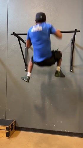 Young men exercise, pose for photos at Tampa gym