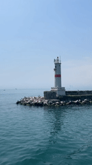 Ferry passenger documents lighthouse and vessel interior near Kadıköy