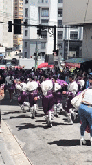 Children in traditional costumes parade through La Paz streets