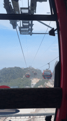 Tourist documents cable car ride, golden statues in Đà Nẵng