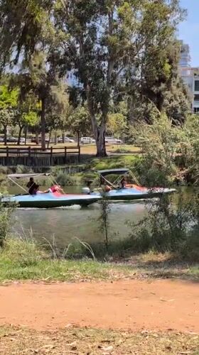 Boats on a Tel Aviv waterway, a summer afternoon snack