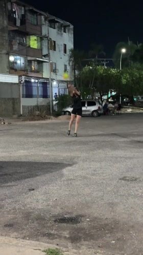 Two people spotted on nighttime street in Tinaquillo, Venezuela