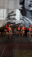 Traditional folk dancers and musicians perform outdoors in Barranco