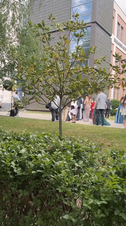 Formal outdoor gathering documented in Blagoevgrad park setting