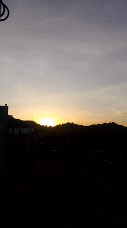 Dawn breaks over Caracas cityscape in multiple recordings