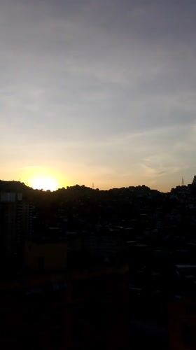 Dawn breaks over Caracas cityscape in multiple recordings