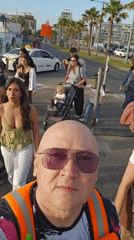 Tel Aviv street scenes: selfie recording, surfboard placement observed