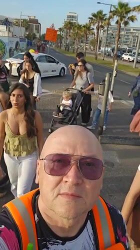 Tel Aviv street scenes: selfie recording, surfboard placement observed