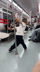 Boy plays with pole on metro train in China